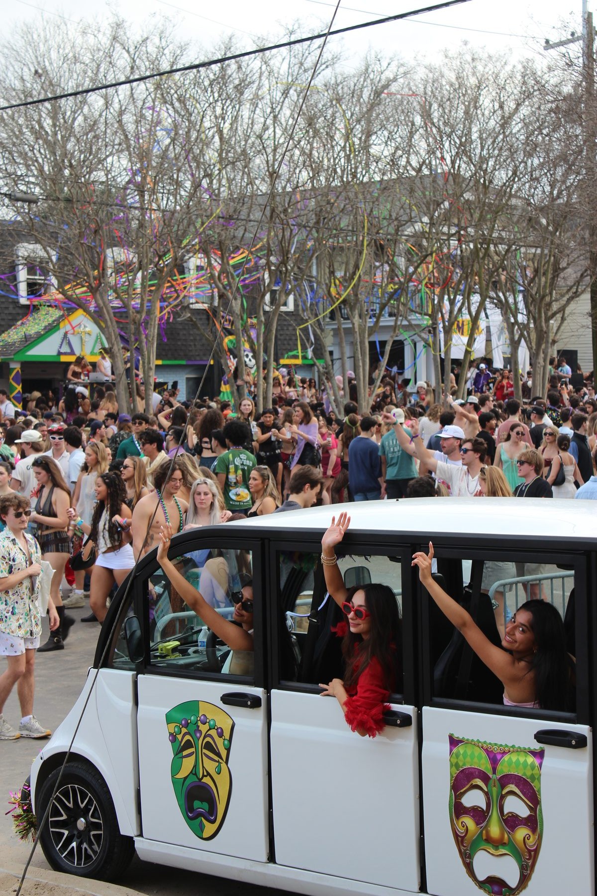 Mardi Gras riders in a Breeze shuttle